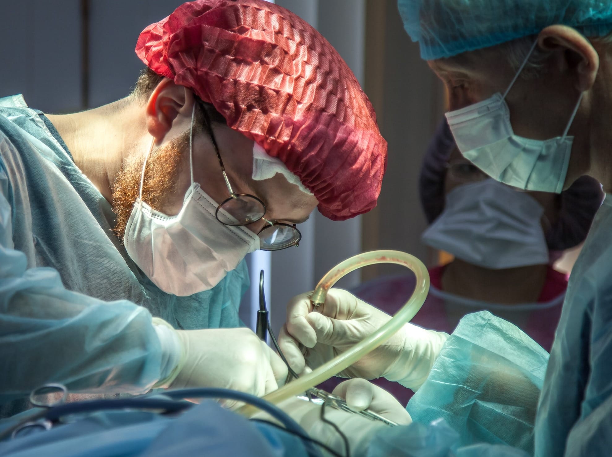 a person in a hospital operating on a patient