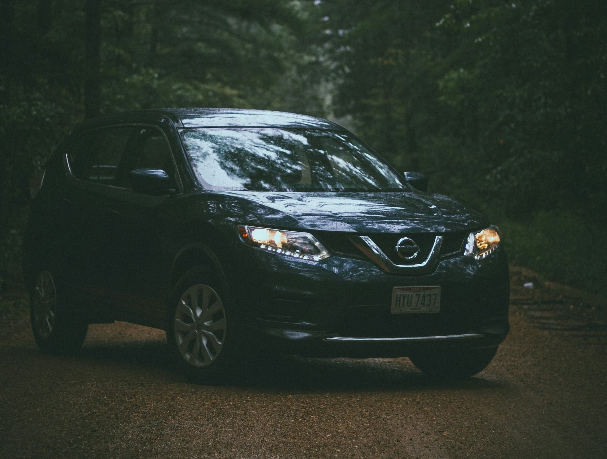 black honda sedan on road