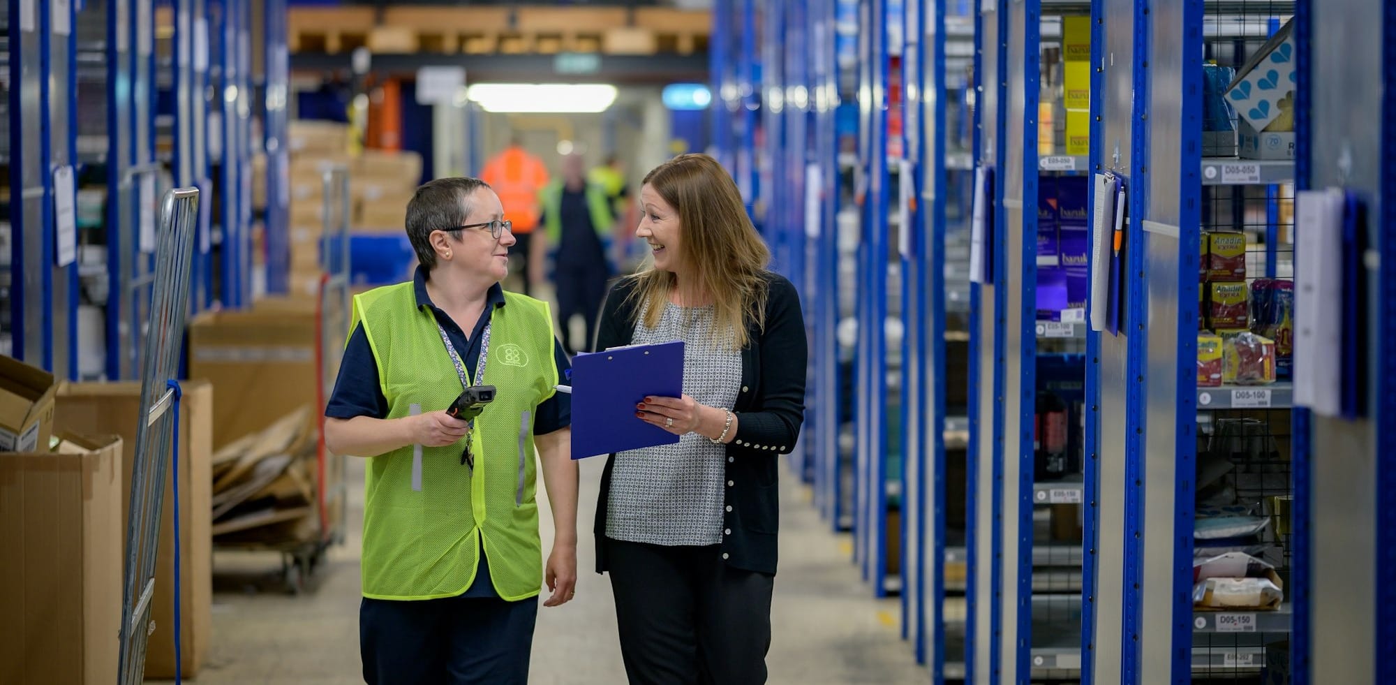 a man and a woman in a warehouse